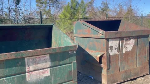Pan of a rural county waste dump location for residents of Burke County Georg Stock Footage 147418404