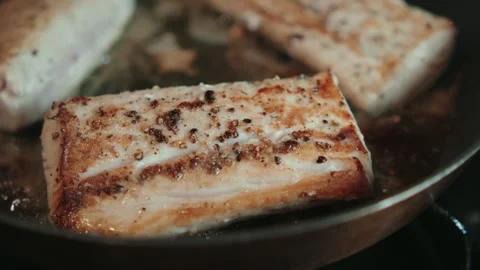 Pan seared Mahi Mahi fillets cooking Stock Footage 290281836