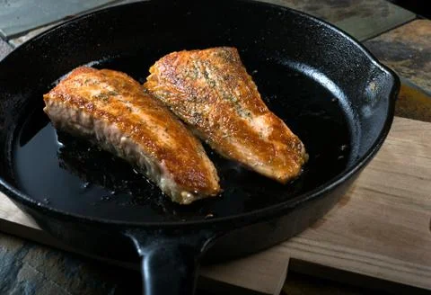 Pan seared salmon fish Stock Photos