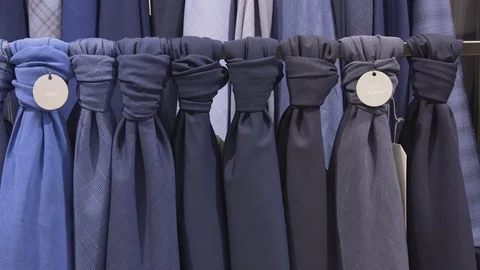 Pan of a selection of fabric for suits Stock Footage 85174830