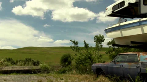 Pan shot of abandoned and rusty cars 스톡 동영상 22802635