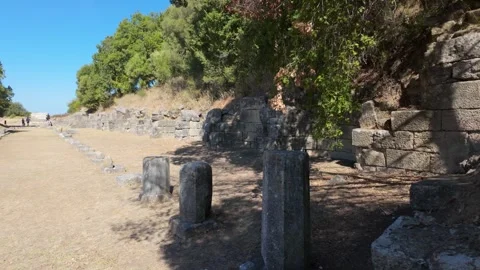 Pan shot from an angle of roman pillars that used to form porticoes Stock Footage 347273739