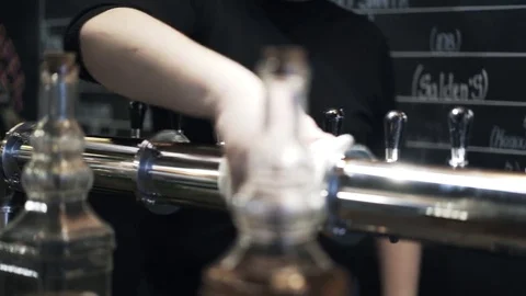 Pan shot of bartender s hands cleaning taps 動画素材 75161820