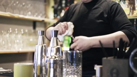 Pan shot of bartender s hands cleanign a glass Stock Footage 75162124