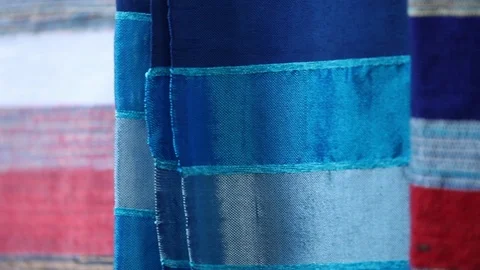 Pan shot of beautiful Carpets hanging outside of a small store on a bazaar Video stock 101015061