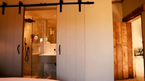 Pan Shot Of Bedroom In Barn Conversion Cottage Video stock 120776719