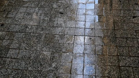 Pan shot of a big puddle on paved street. Stock Footage 122373525