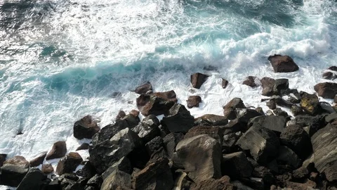 Pan Shot of Big Rolling Waves Splashing Against Steep Lava Cliffs, Azores Stock Footage 89083489
