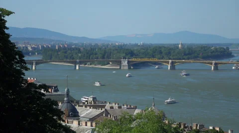 Pan shot of Budapest with the Danube river the Parliament and some ships Video stock 39635316