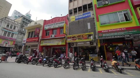 A pan shot of the city center in the Chinatown area known as Petaling Street Stock Footage