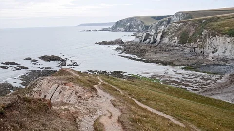 Pan shot of cliffs and shore 스톡 동영상 114529513