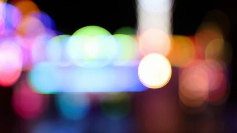 Pan shot of colorful blinking defocused lights at carnvial Stock Footage 120138289