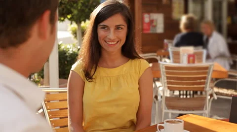 Pan shot of couple in cafe with present Stock Footage 43618257