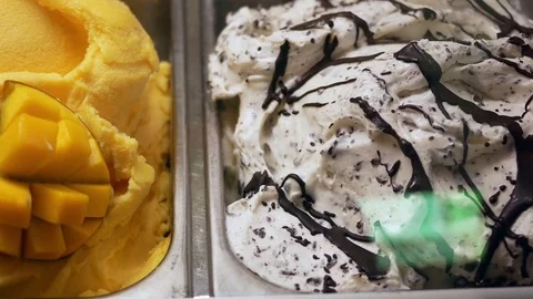 Pan shot of display ice cream for sale inside shopping mall Stock Footage 82549043