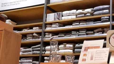 Pan shot of display table clothes on rack for sale with 4k resolution 動画素材 89679788