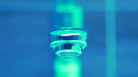 Pan shot of dripping tap. Sci-fi, slow motion Stock Footage 106437857