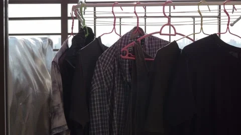 Pan shot of drying clothes in the sun Stock Footage 103209674