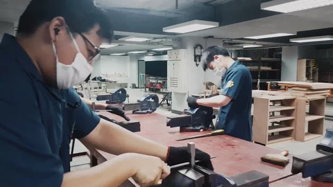 Pan shot of Engineering students perform hand file Stock-Footage 102570181