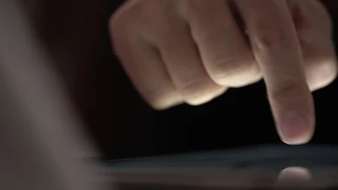 Pan shot of finger touching tablet Stock Footage 74625018