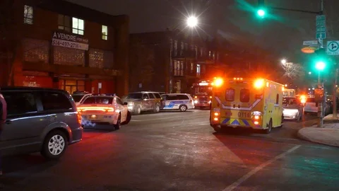 Pan shot of hostage scene aftermath with investigators and command center Stock Footage 100180514