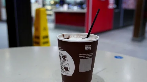 Pan shot of hot Mccafe coffee at mcdonalds fast food restaurant 스톡 동영상 74479181