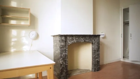 Pan Shot Inside A Room With A Heater And Basic Furniture Video stock 126700522