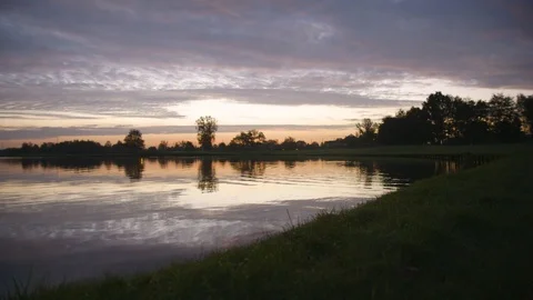 Pan Shot Of A Lake At Sunset Stock Footage 127036038