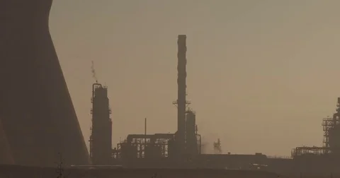 Pan shot of a large oil refinery Stock Footage