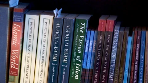 Pan shot of a library full of islamic books. Stock Footage 99608508