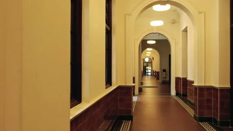 Pan shot of long empty hallway of a large building. Stock Footage 146261679