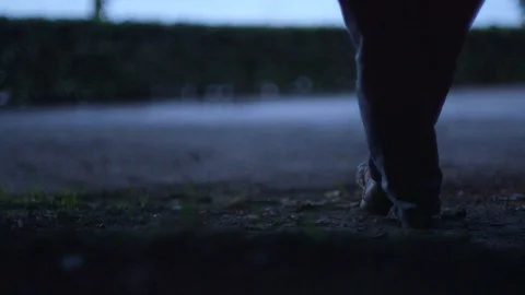 Pan Shot Off A Man Taking Off His Shoes Revealing His Feet While Sitting On Stock Footage 126701151