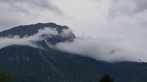 Pan shot of mountains and clouds Stock Footage 89749047