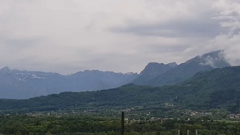Pan shot of mountains and clouds Stock Footage 89749158