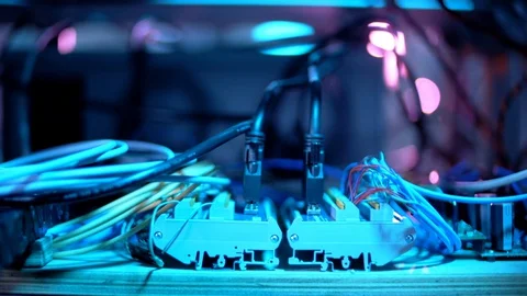 Pan Shot Of Multiple Wires Plugged In With Stunning Blue And Pink Colors Video stock 129399008