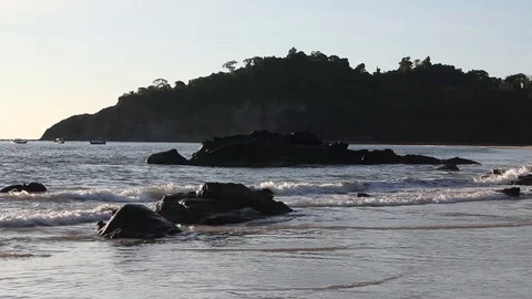 Pan shot of ocean and beach with tourists, Ngapali, Myanmar Stock Footage 123765298