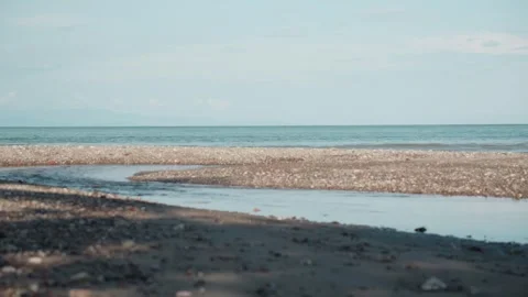 Pan shot of Ocean estuary at one of the most beautiful beaches in Costa Rica Видео 345054254