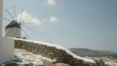 Pan shot of an old windmill above chora on mykonos Stock Footage 69167503