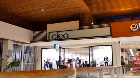 Pan shot of open cleo store and closed Sears store inside Coquitlam mall Stock Footage 85292666