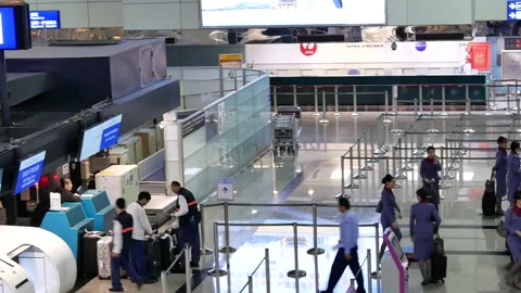 Pan shot of passengers going to the China airline check in desks Video stock 102009689