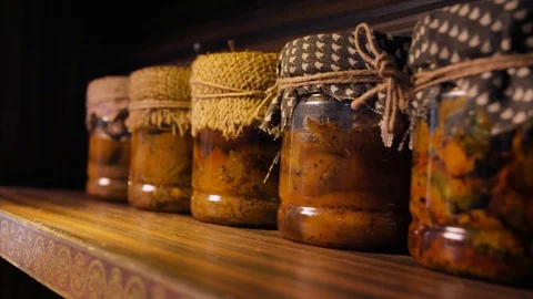 Pan shot of ready Indian pickles / achar kept in bottles for sale Stock Footage 117467367