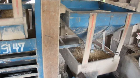 Pan shot of rice cleaning machine.  Stock Footage 54473221