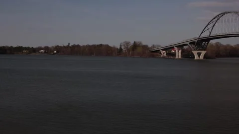 Pan shot right to left. Lake Champlain Bridge to Lake Champlains edge. Stock-Footage 273607930