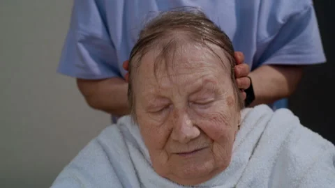 Pan Up Shot of Senior Client Relaxing with Head Massage 库存影片 311304844