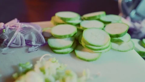 Pan shot of sliced vegetables on the cutting board Stock Footage 104200148