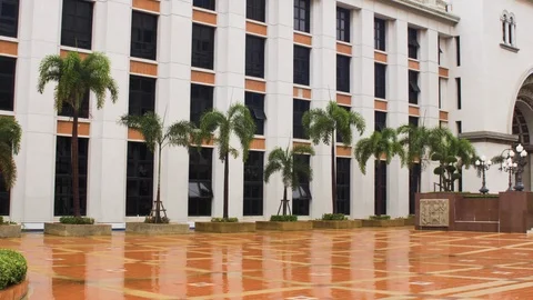 Pan shot of SM SR Building at Assumption University (ABAC) on rainy day Stock Footage 112670870