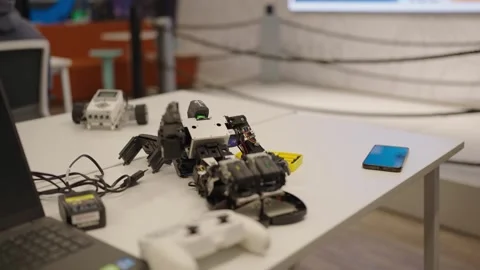 Pan Shot of Small Robot Model on White Table Video stock 320171364