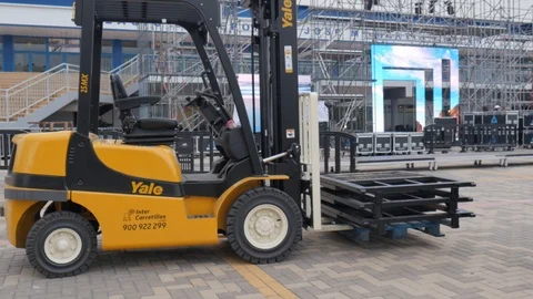 Pan shot of the technical preparation of the stage of an outdoor event Stock Footage 123405322