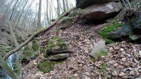 Pan shot towards a waterfall Stock Footage 73275315