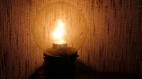 Pan shot of turned on old lamp Stock Footage 88828532