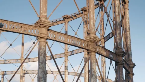 Pan shot of two large ornate rusting Victorian gas holders at gasworks in urban Video stock 128918679